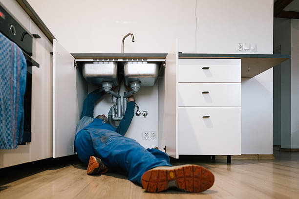 Professional Emergency Plumber technician working in Walcott, IA